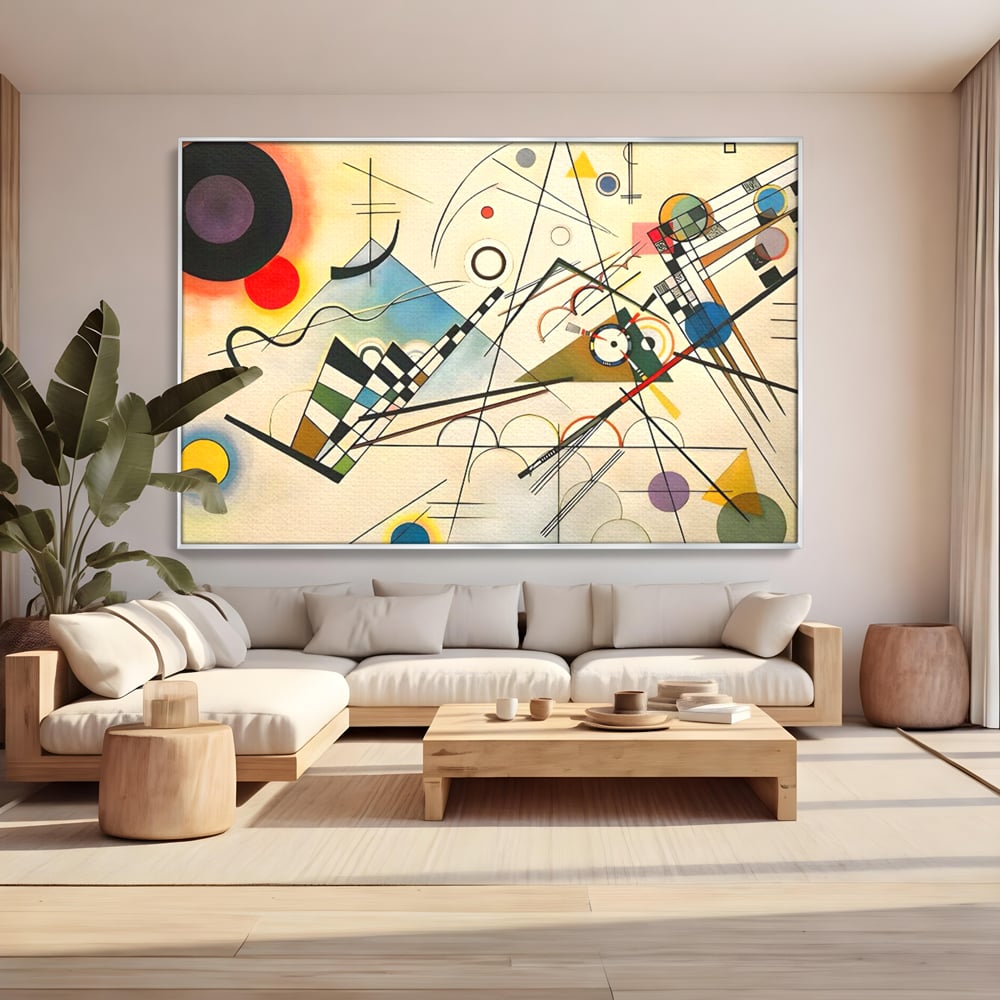 Tablou canvas cu pictura abstracta cu forme geometrice colorate, in rama de aluminiu argintiu, pe perete intr-un living